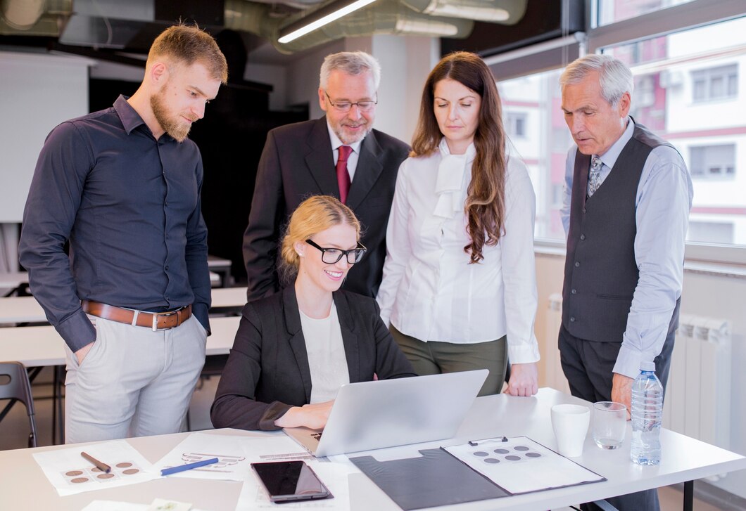 group-business-partners-looking-astonishingly-laptop-display_23-2147923441